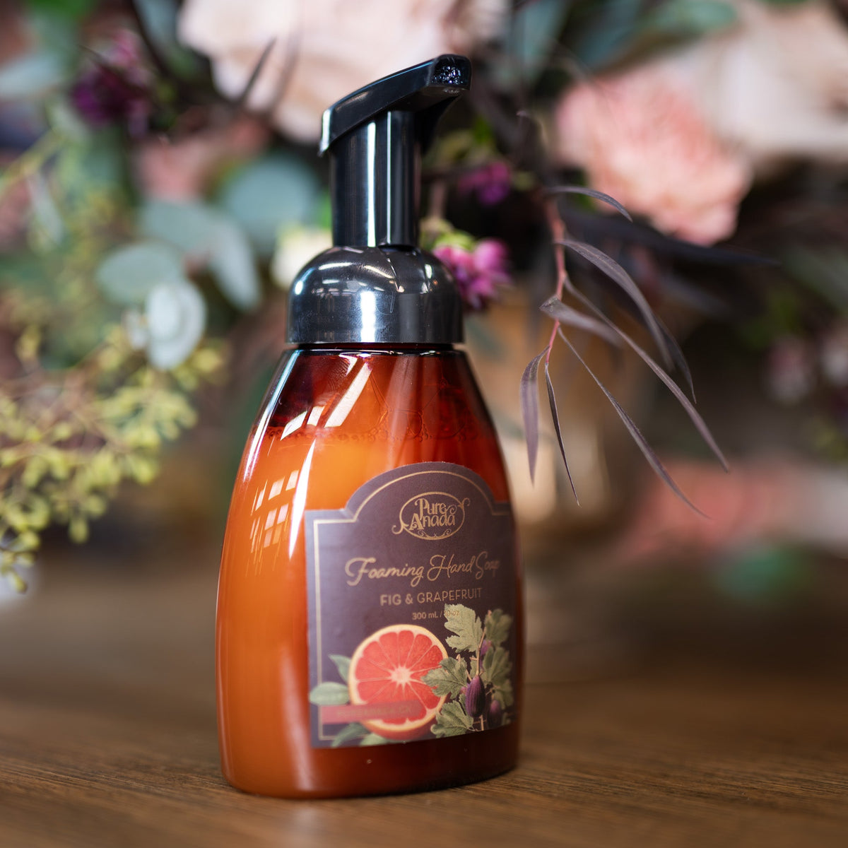 Hand soap bottle with floral background