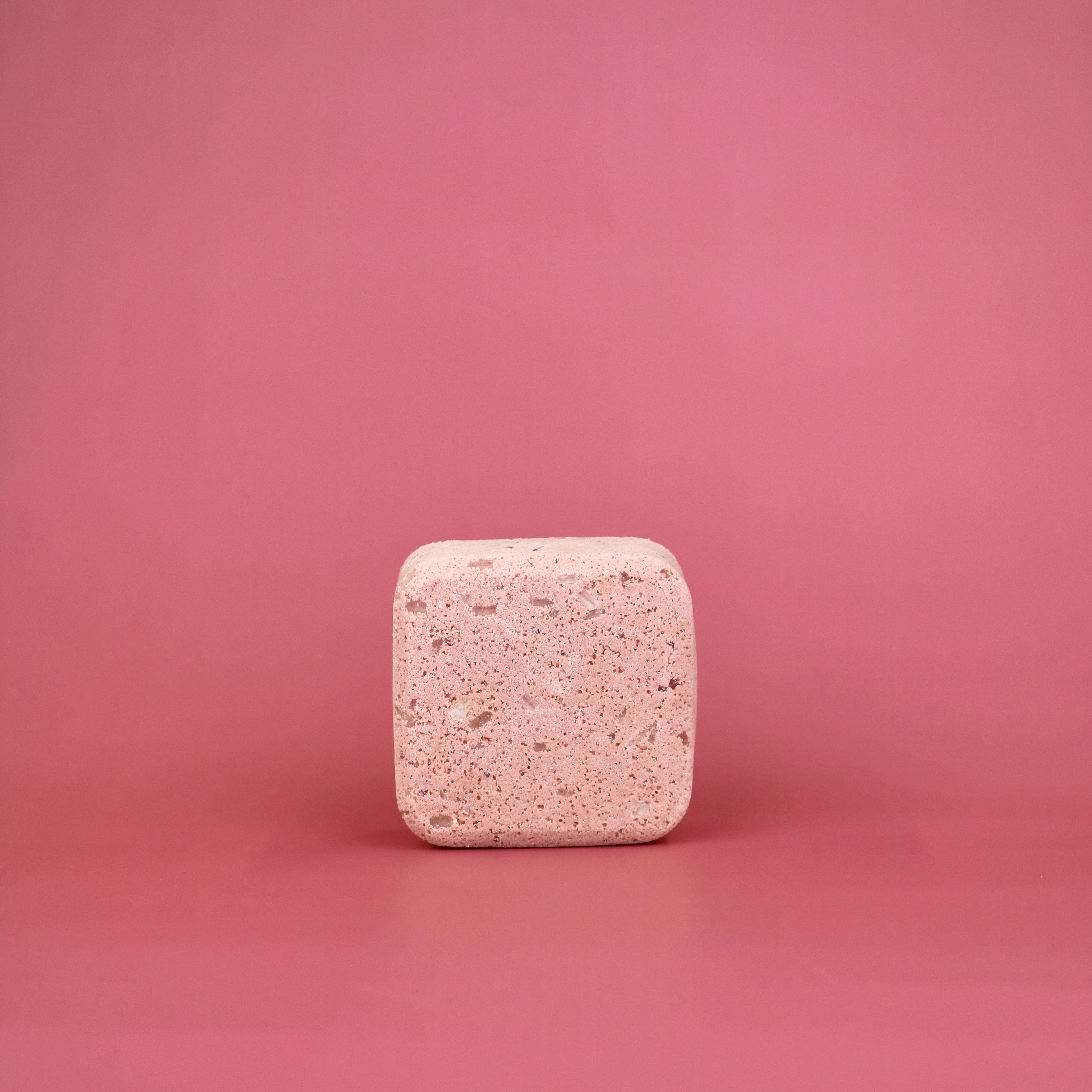Square pink tablet on a pink background