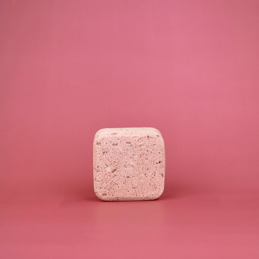 Square pink tablet on a pink background