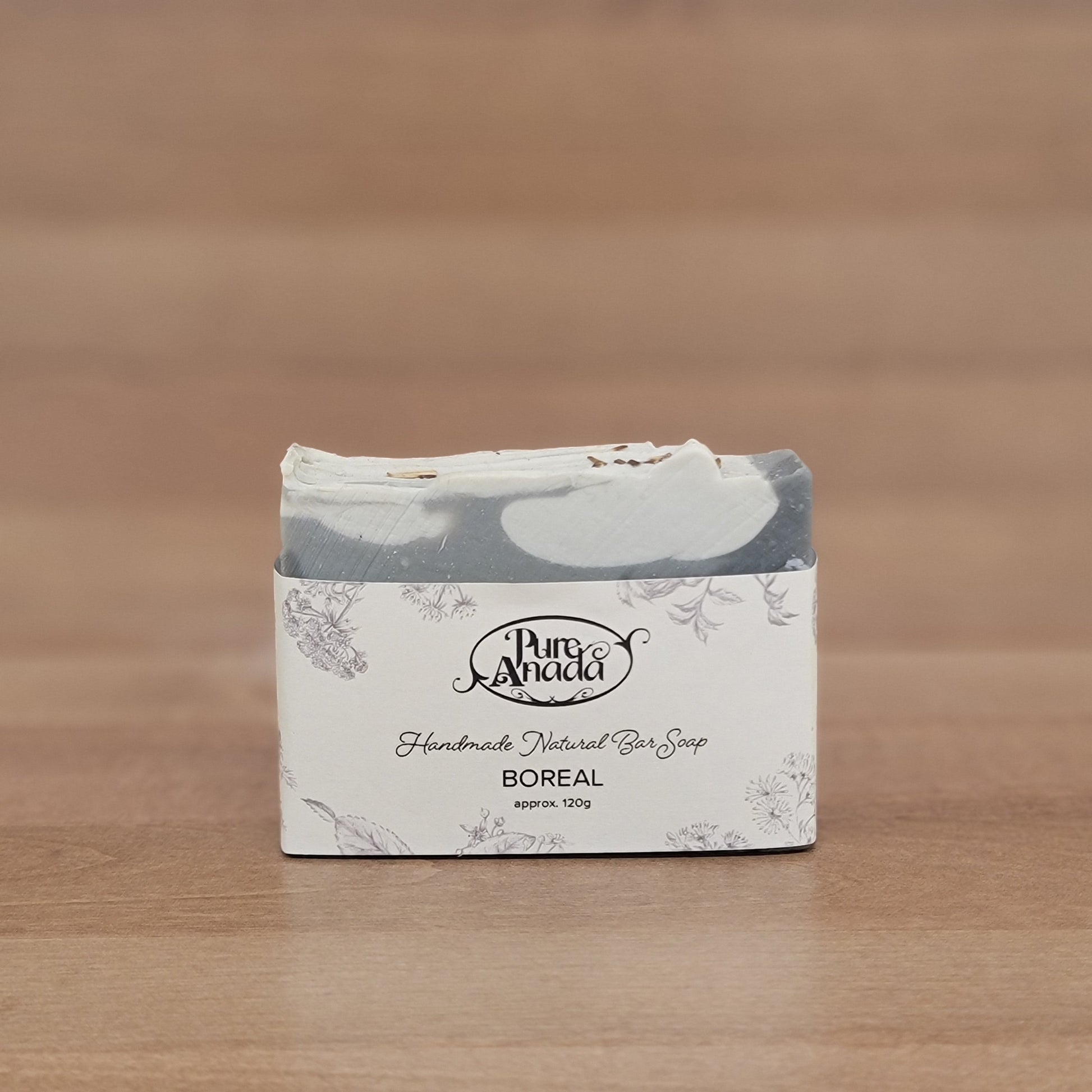 Product packaging with a brand logo on a wooden surface