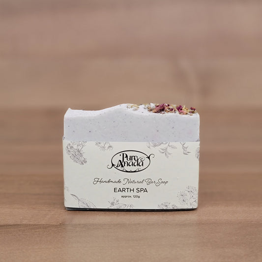 Earth day Pure Anada Soap bar with decorative packaging on a wooden surface